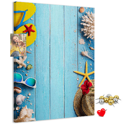 Wall cork memo board Summer accessories on a blue wood background
