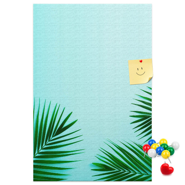 Pin board Tropical leaves on a blue background