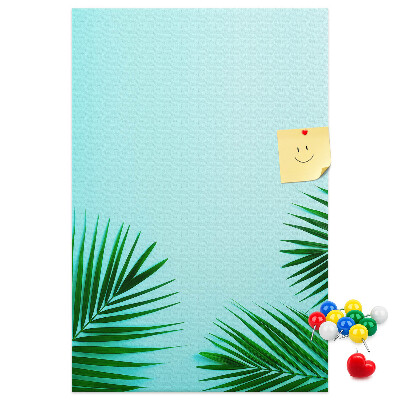 Pin board Tropical leaves on a blue background