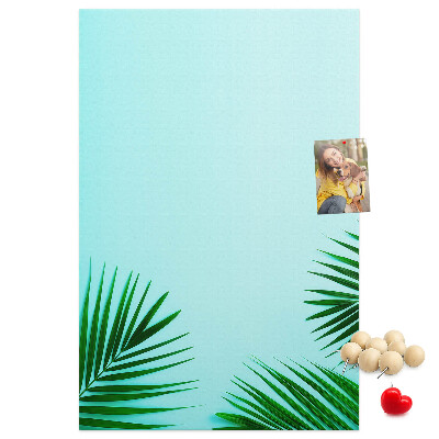 Pin board Tropical leaves on a blue background