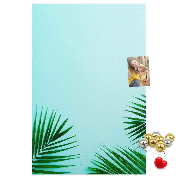 Pin board Tropical leaves on a blue background