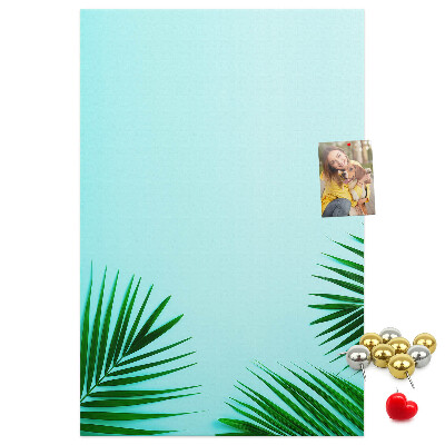 Pin board Tropical leaves on a blue background