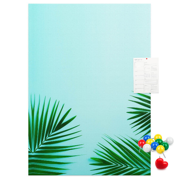 Pin board Tropical leaves on a blue background
