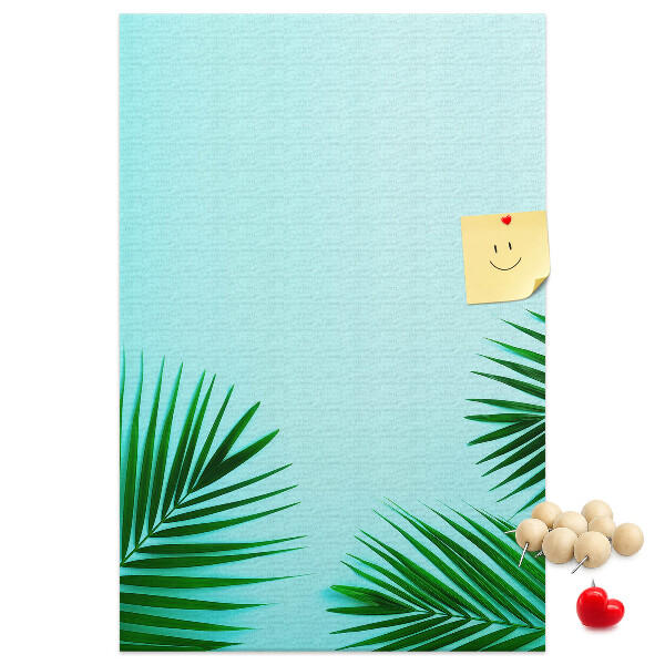 Pin board Tropical leaves on a blue background