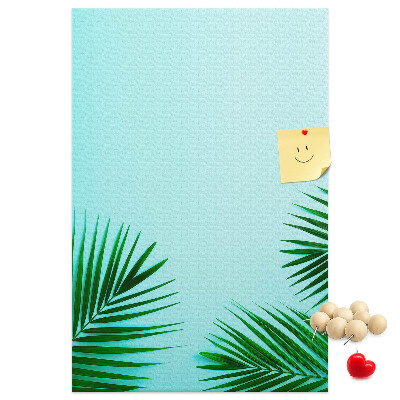 Pin board Tropical leaves on a blue background