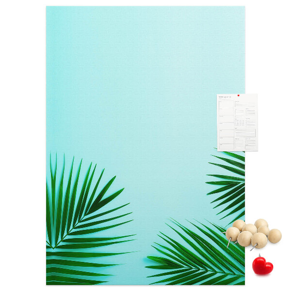 Pin board Tropical leaves on a blue background