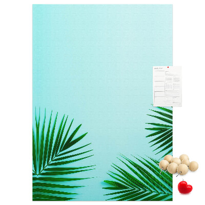 Pin board Tropical leaves on a blue background