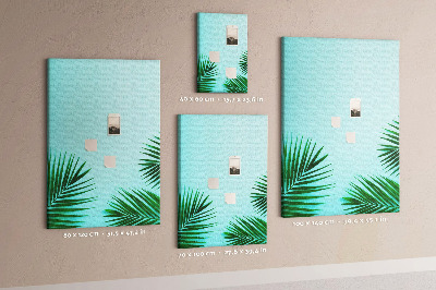 Pin board Tropical leaves on a blue background