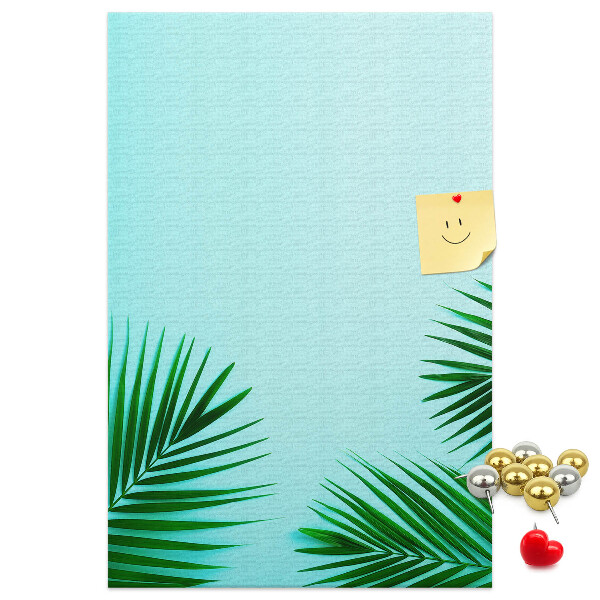 Pin board Tropical leaves on a blue background