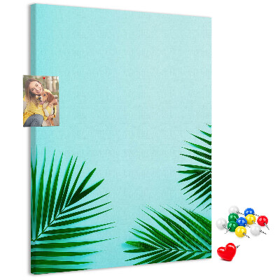 Pin board Tropical leaves on a blue background