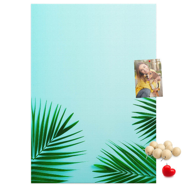 Pin board Tropical leaves on a blue background