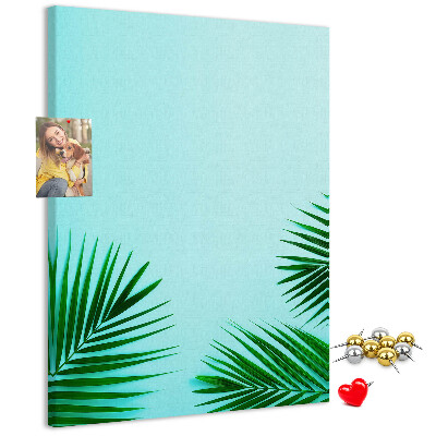 Pin board Tropical leaves on a blue background