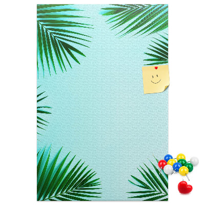 Wall cork memo board Palm leaves on a blue background