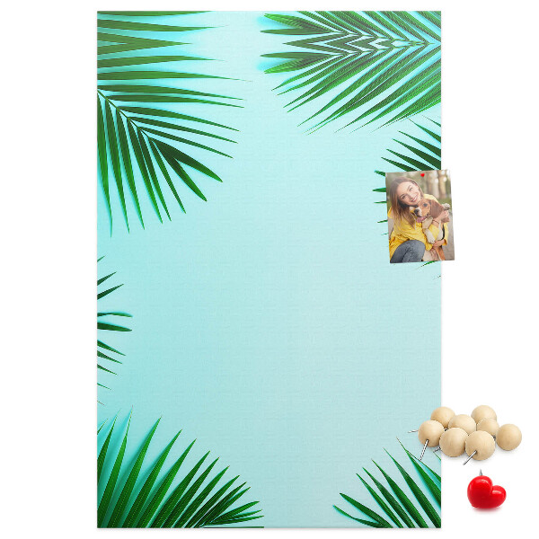 Wall cork memo board Palm leaves on a blue background