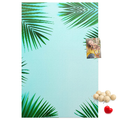 Wall cork memo board Palm leaves on a blue background