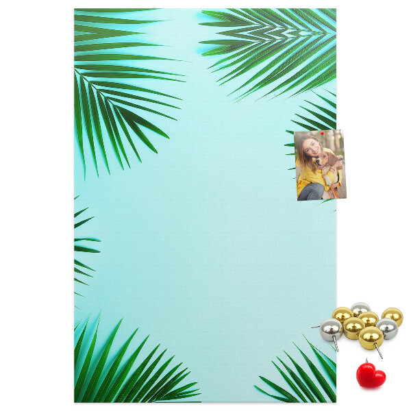 Wall cork memo board Palm leaves on a blue background