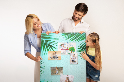 Wall cork memo board Palm leaves on a blue background