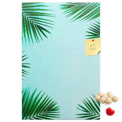Wall cork memo board Palm leaves on a blue background