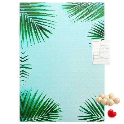 Wall cork memo board Palm leaves on a blue background