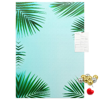 Wall cork memo board Palm leaves on a blue background