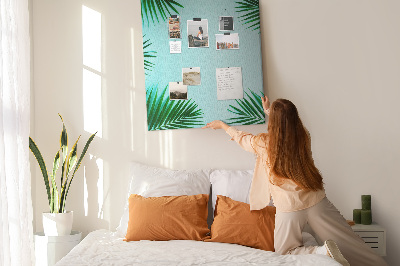 Wall cork memo board Palm leaves on a blue background