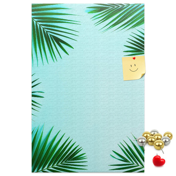 Wall cork memo board Palm leaves on a blue background