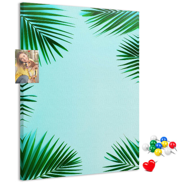 Wall cork memo board Palm leaves on a blue background