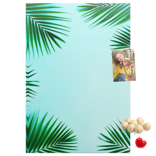 Wall cork memo board Palm leaves on a blue background