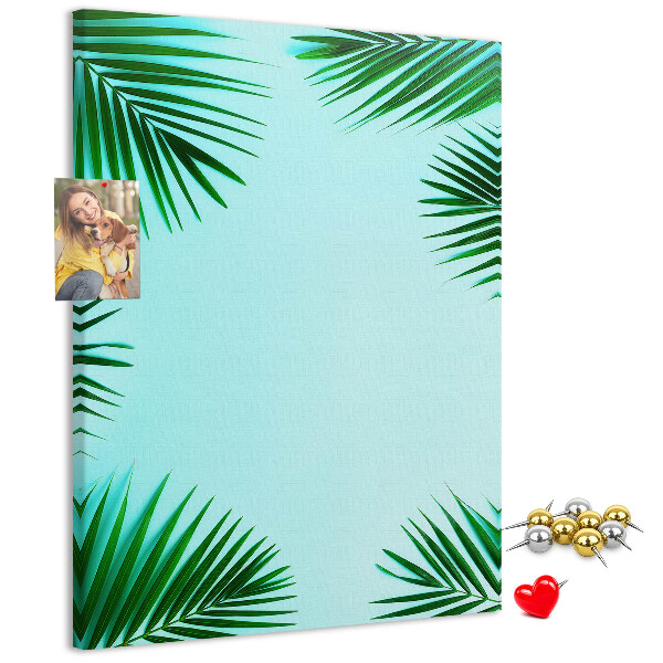 Wall cork memo board Palm leaves on a blue background