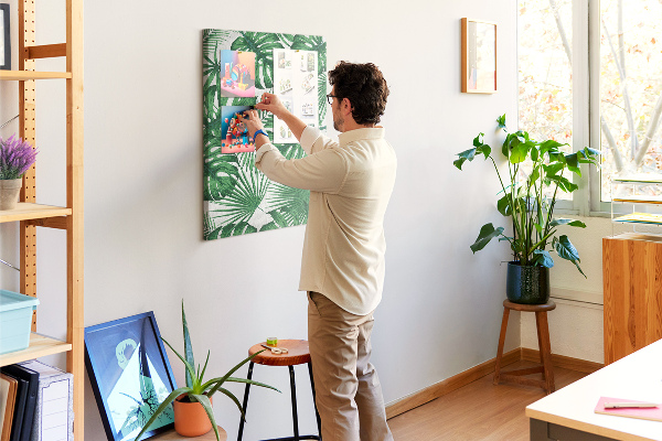 Wall cork memo board Monstera leaves on a light background