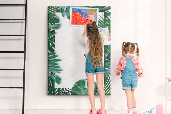 Pin board Tropical leaves surrounded by a white frame