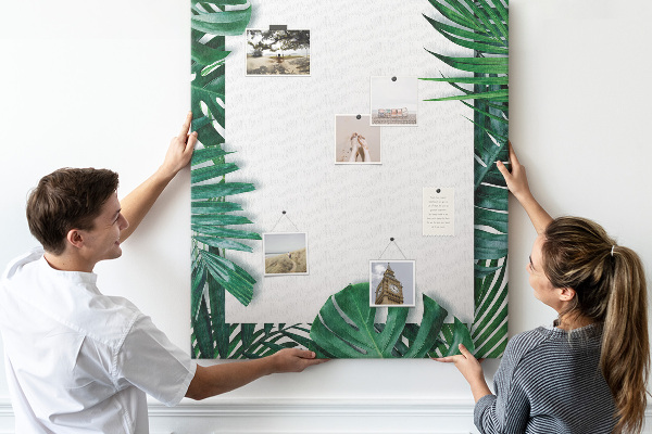 Pin board Tropical leaves surrounded by a white frame