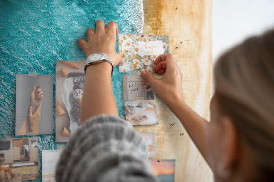 Memo cork board A beach with waves and people walking around