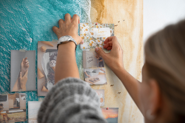 Memo cork board A beach with waves and people walking around