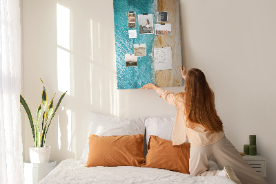 Memo cork board A beach with waves and people walking around