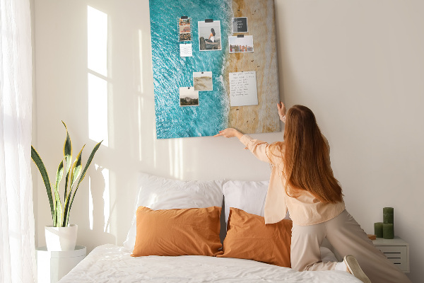 Memo cork board A beach with waves and people walking around