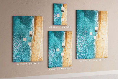 Memo cork board A beach with waves and people walking around
