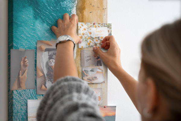 Memo cork board A beach with waves and people walking around