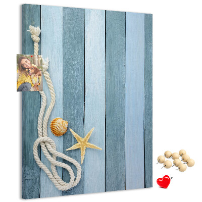 Pin board Seaside vibe with blue planks and a shell