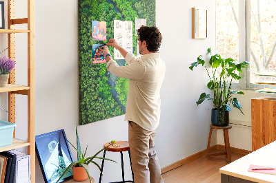 Cork notice board A green landscape with a winding river