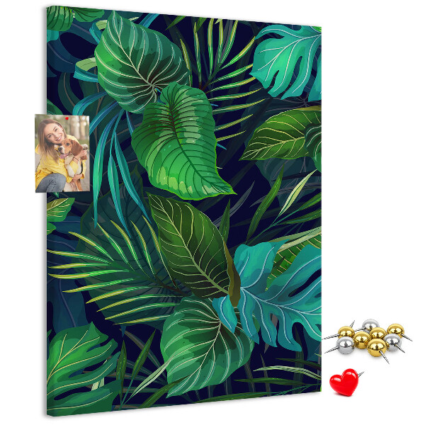 Cork notice board Tropical leaves on a dark background