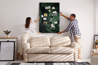 Memo cork board Green leaves in a dark background