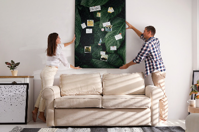 Memo cork board Green leaves in a dark background