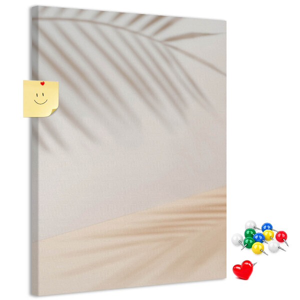 with delicate shadows of palm trees on a light background