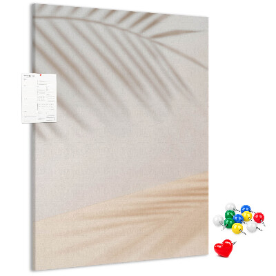 Cork notice board Delicate shadows of palm trees on a light background