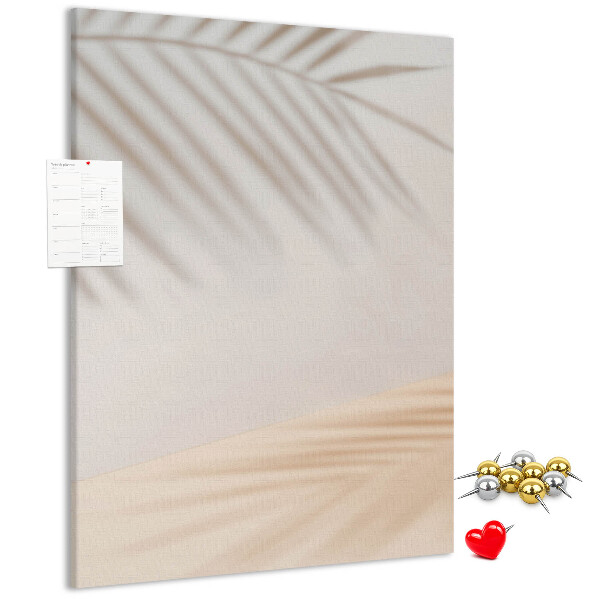 Cork notice board Delicate shadows of palm trees on a light background