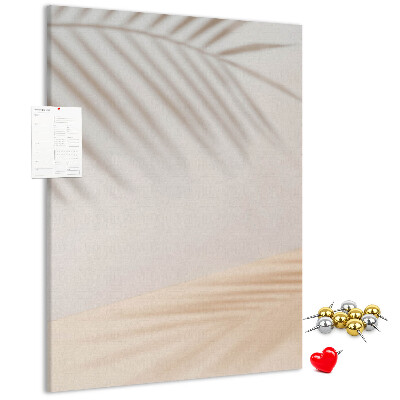 Cork notice board Delicate shadows of palm trees on a light background