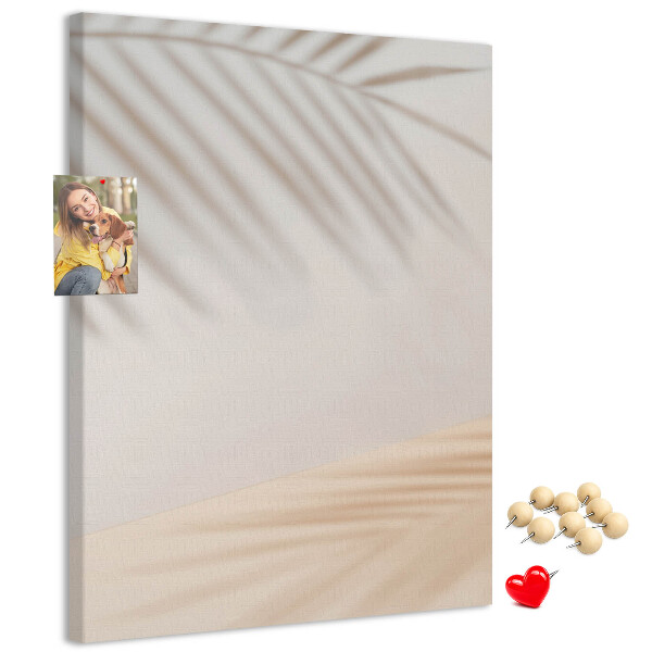 Cork notice board Delicate shadows of palm trees on a light background