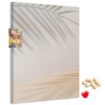 Cork notice board Delicate shadows of palm trees on a light background