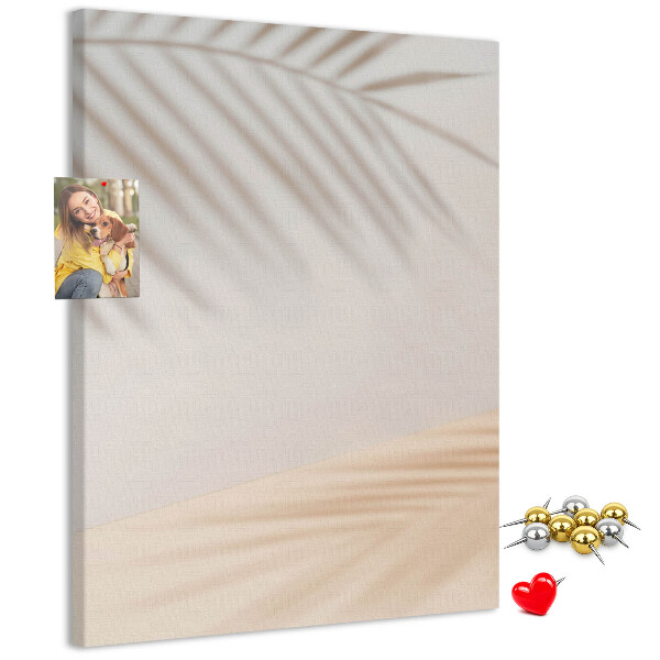 Cork notice board Delicate shadows of palm trees on a light background